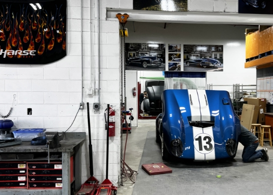 Blue car with the hood open